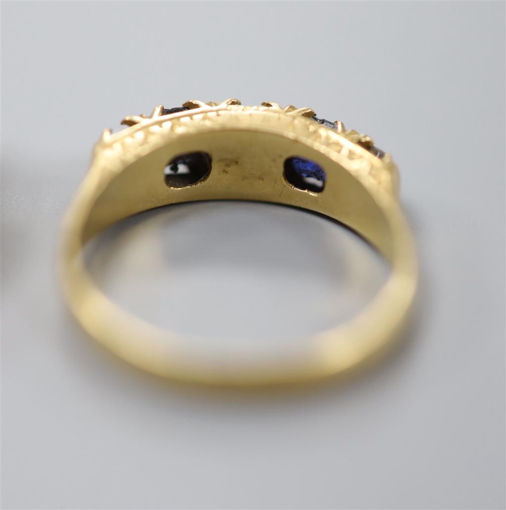 A late Victorian 18ct gold, sapphire and white paste set half hoop ring & a 9ct paste set ring.